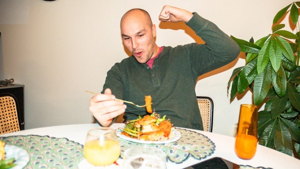 Mike eating a good plate of gluten free food during christmas dinner.
